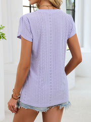 Lavender eyelet tee with petal sleeves and V-neck, featuring a textured pattern.