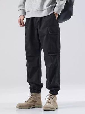 Black relaxed fit cargo sweatpants with elastic cuffs and side pockets.
