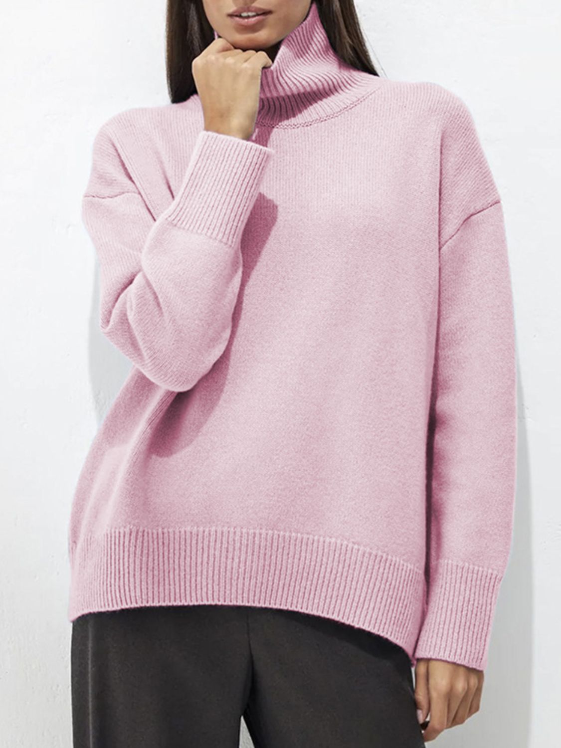 Relaxed fit ribbed turtleneck sweater in Blush Pink acrylic with ribbed cuffs and hem.