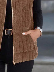 Brown fleece zip-up vest with pockets and ribbed texture.