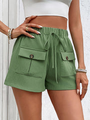 Textured gum leaf cargo shorts with drawstring waist and decorative button pockets.