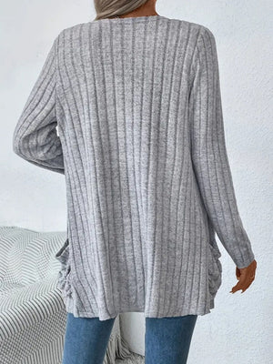 Light gray ribbed knit cardigan with long sleeves and ruched side details.