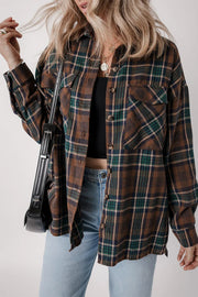 Plaid snap jacket in brown, green, and blue with button-flap chest pockets and a relaxed fit.