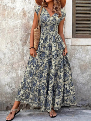 Blue flower damask print maxi dress with cap sleeves and tiered skirt.