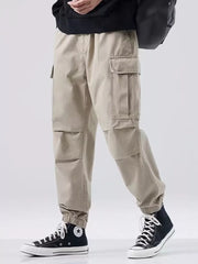 Khaki relaxed fit cargo sweatpants with multiple pockets and elastic cuffs.