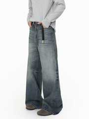 Men's wide leg denim jeans in blue wash with a relaxed fit and gradient fade.