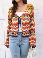 Chevron knit tie-front cardigan with multicolor wavy stripes and open knit details.