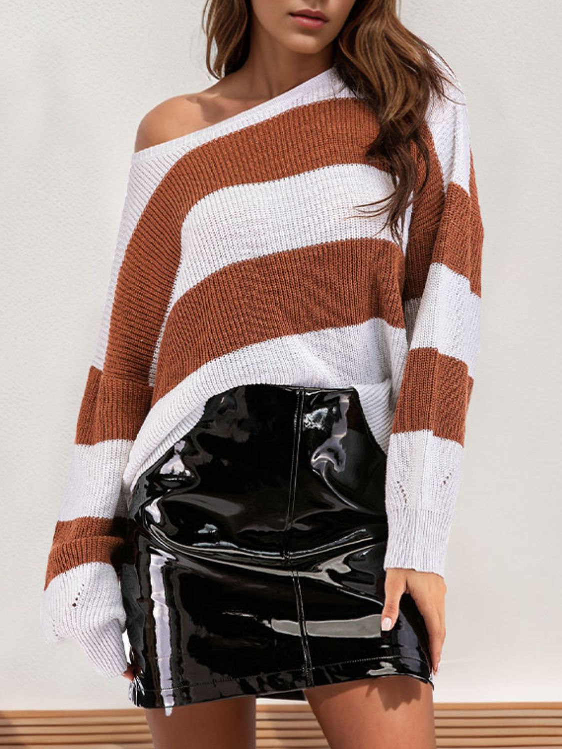 Wide stripe boatneck knit sweater in caramel and white, with a relaxed fit.