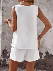 White cotton two-piece set with sleeveless top and shorts.
