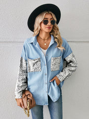 Light denim overshirt with leopard print sleeves and chest pockets.