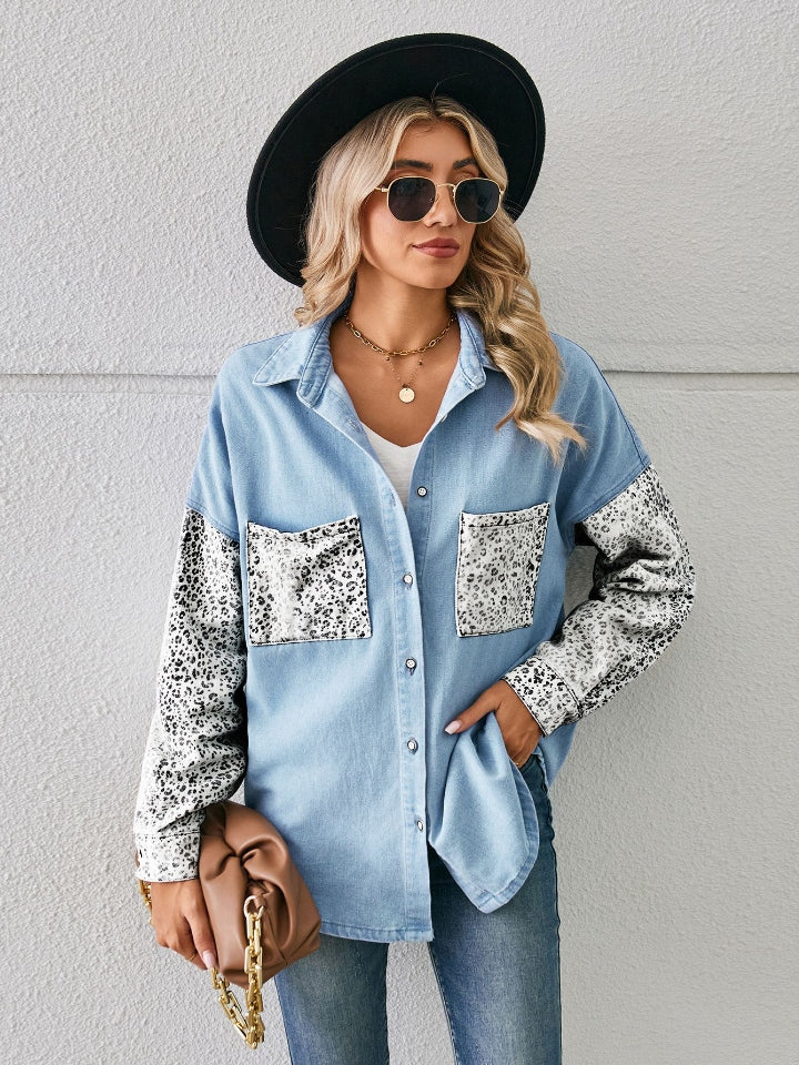 Light denim overshirt with leopard print sleeves and chest pockets.