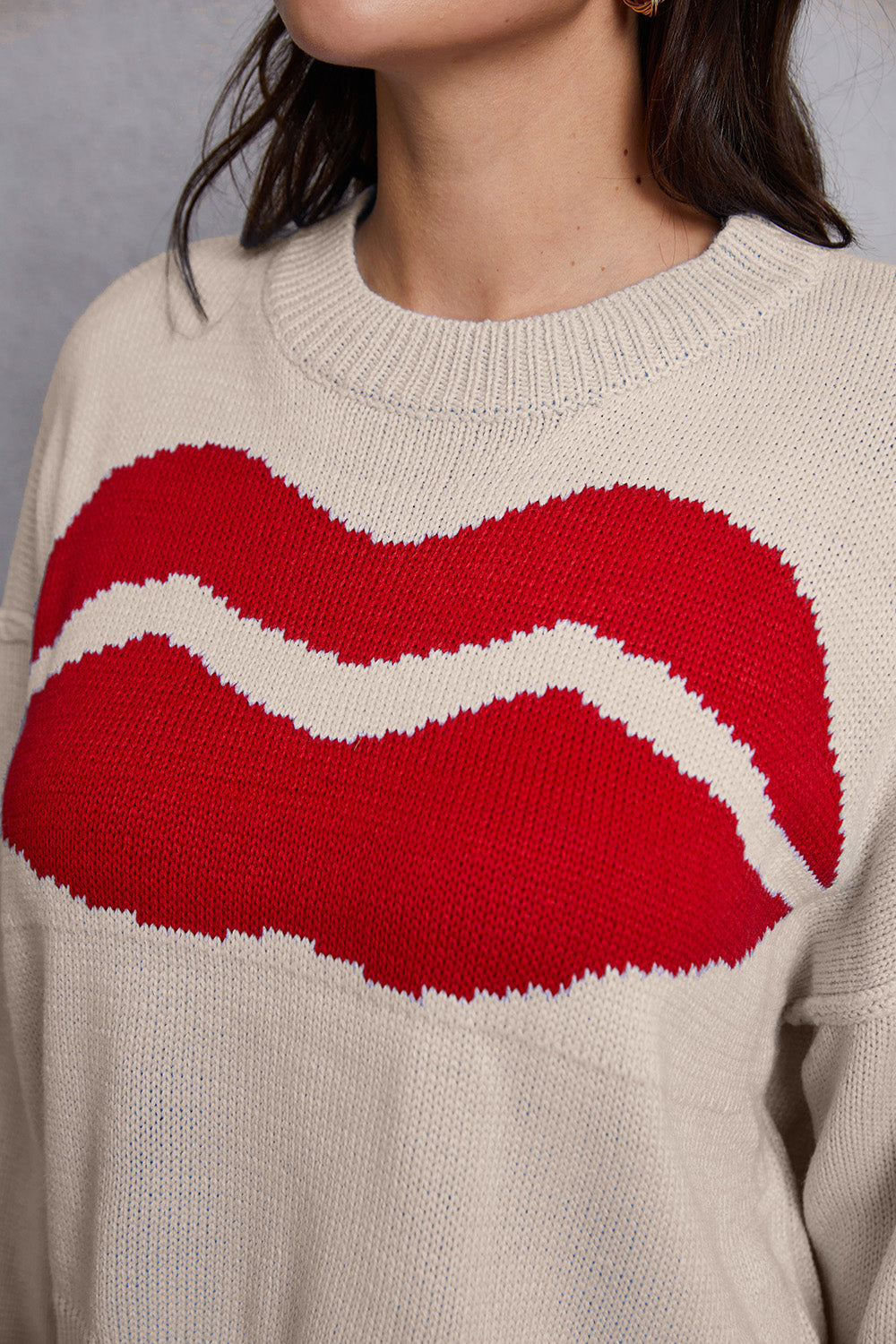 Kiss graphic knit sweater in cream with red lips pattern, crew neck, long sleeves.