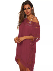 Jujube crochet V-neck cover-up dress with cutout details and fringe trim.