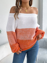 Off-shoulder knit sweater with colorblock pattern in white and orange, featuring balloon sleeves.