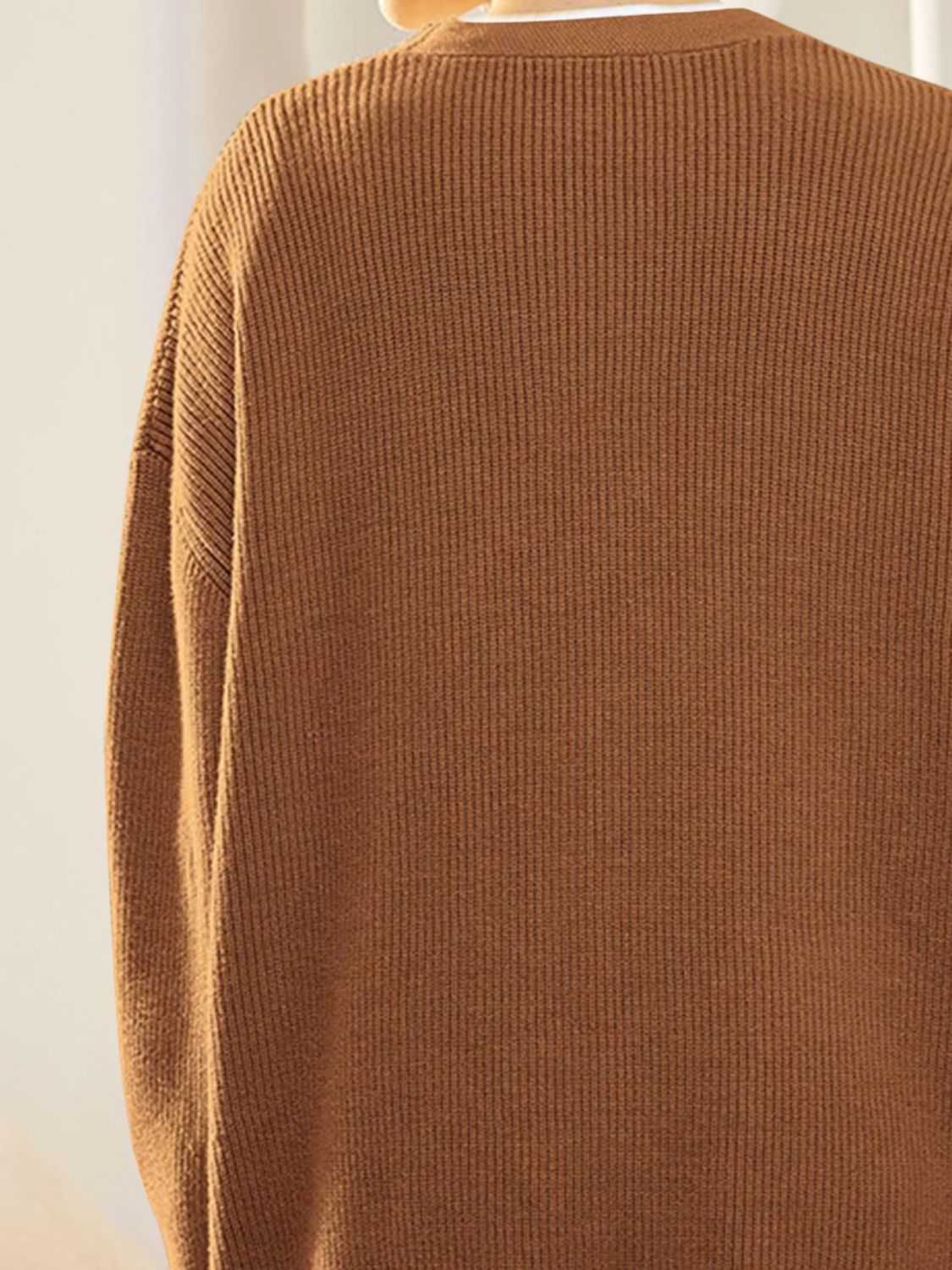 Ribbed knit cardigan in Ochre with balloon sleeves and button detail.