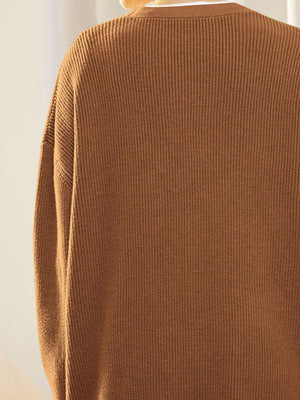 Ribbed knit cardigan in Ochre with balloon sleeves and button detail.