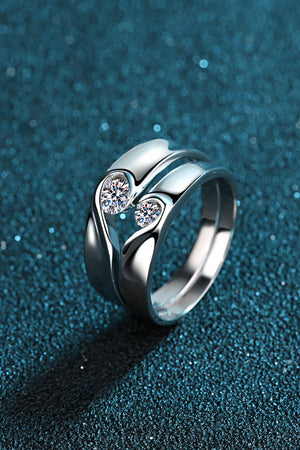 Curved Embrace diamond ring set for men and women, featuring two intertwined bands with sparkling stones.