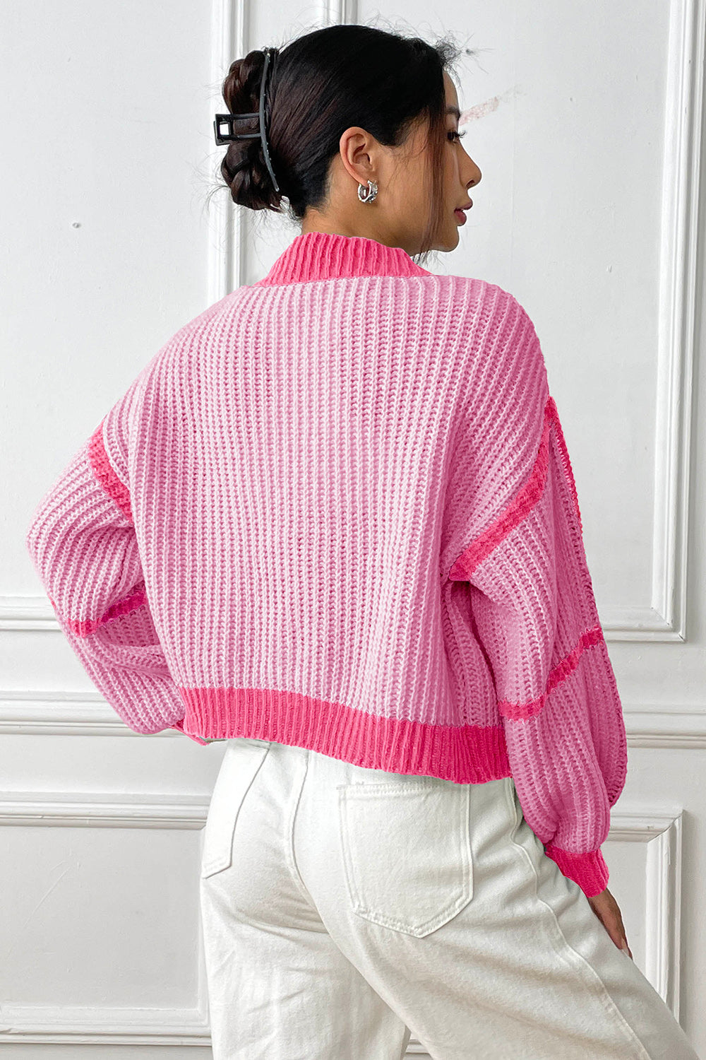 Colorblock ribbed open cardigan in pink with a mock neck and balloon sleeves.