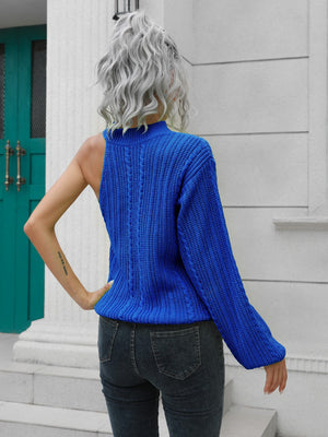 Royal blue acrylic cable knit sweater with asymmetric shoulder detail and mock neck.