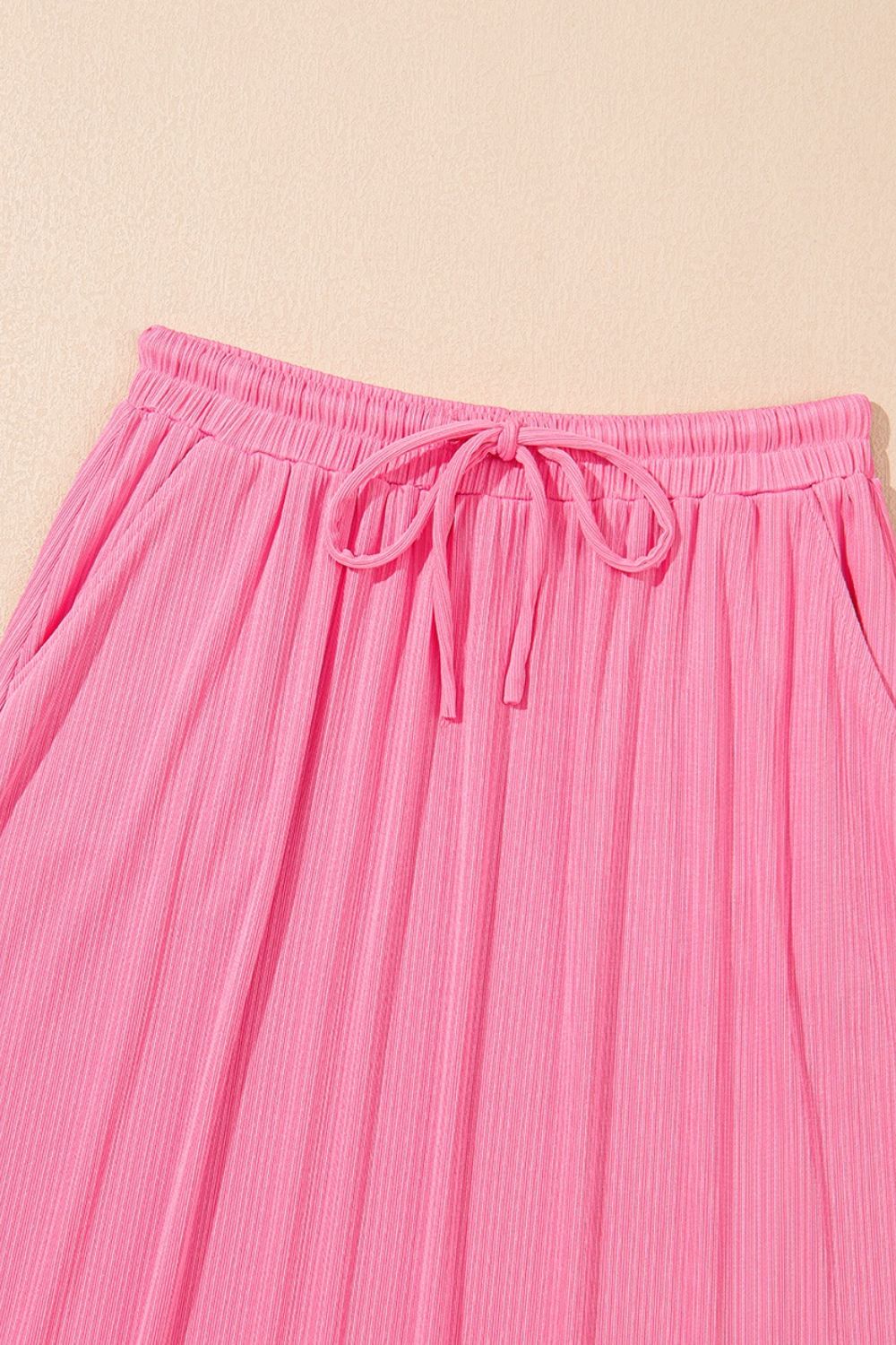 Pink ribbed co-ord skirt set with drawstring waist and pockets