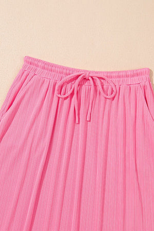Pink ribbed co-ord skirt set with drawstring waist and pockets