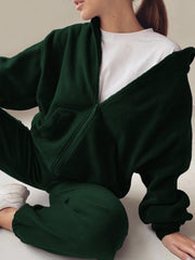 Dark green fleece zip-up hoodie with white t-shirt and matching joggers.