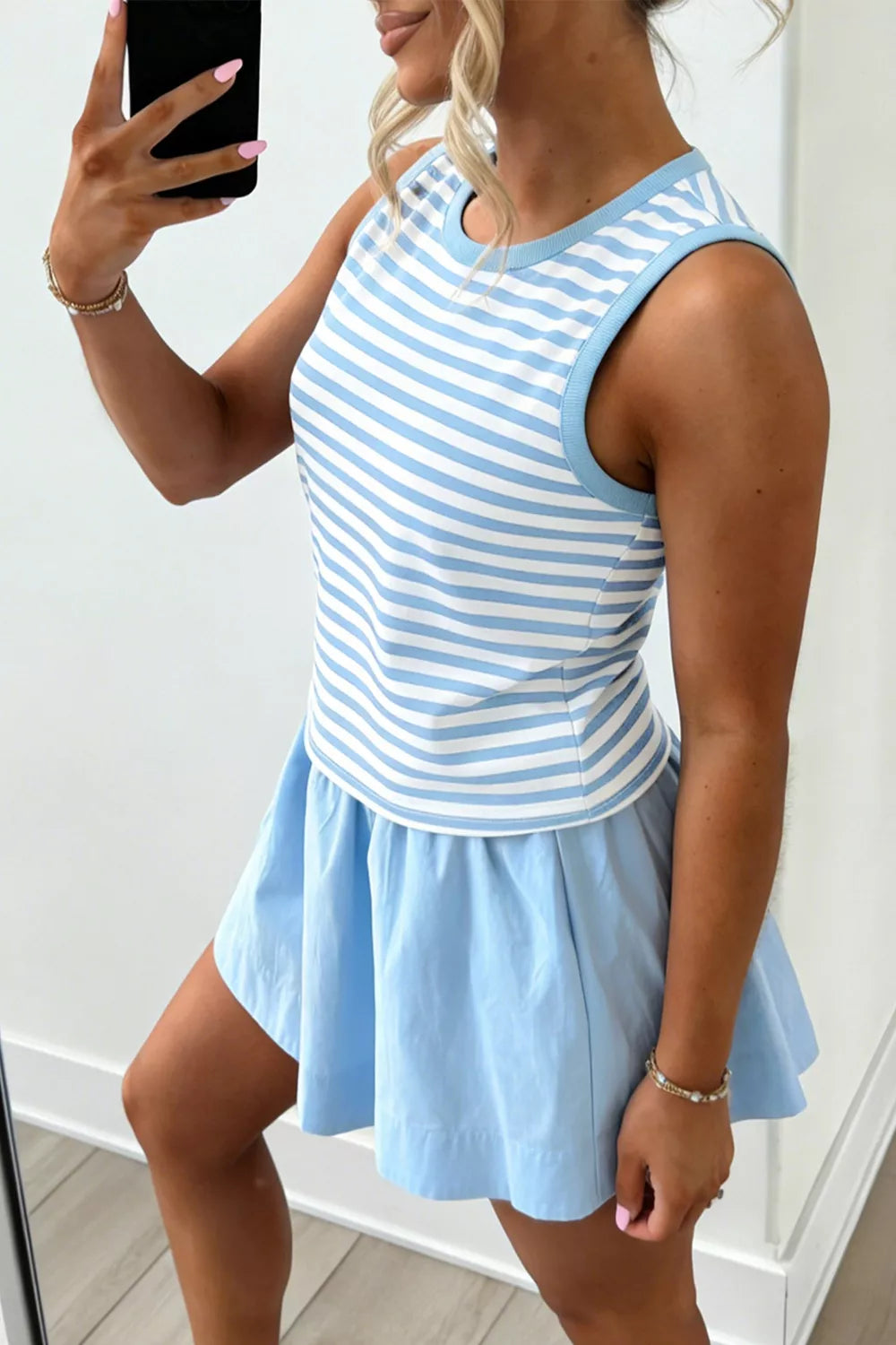 Two-piece blue and white striped tank top and light blue skort set