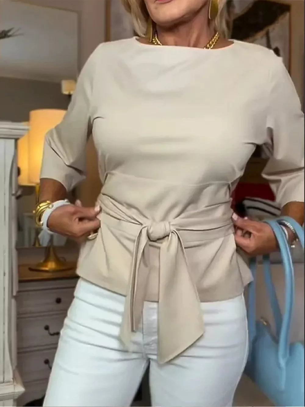 Camel t-shirt with 3/4 sleeves and a tied waist detail.