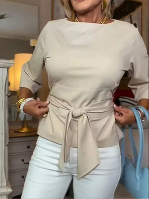 Camel t-shirt with 3/4 sleeves and a tied waist detail.