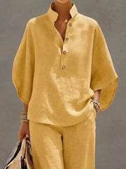 Yellow button-down loungewear set with wide sleeves and a stand collar.