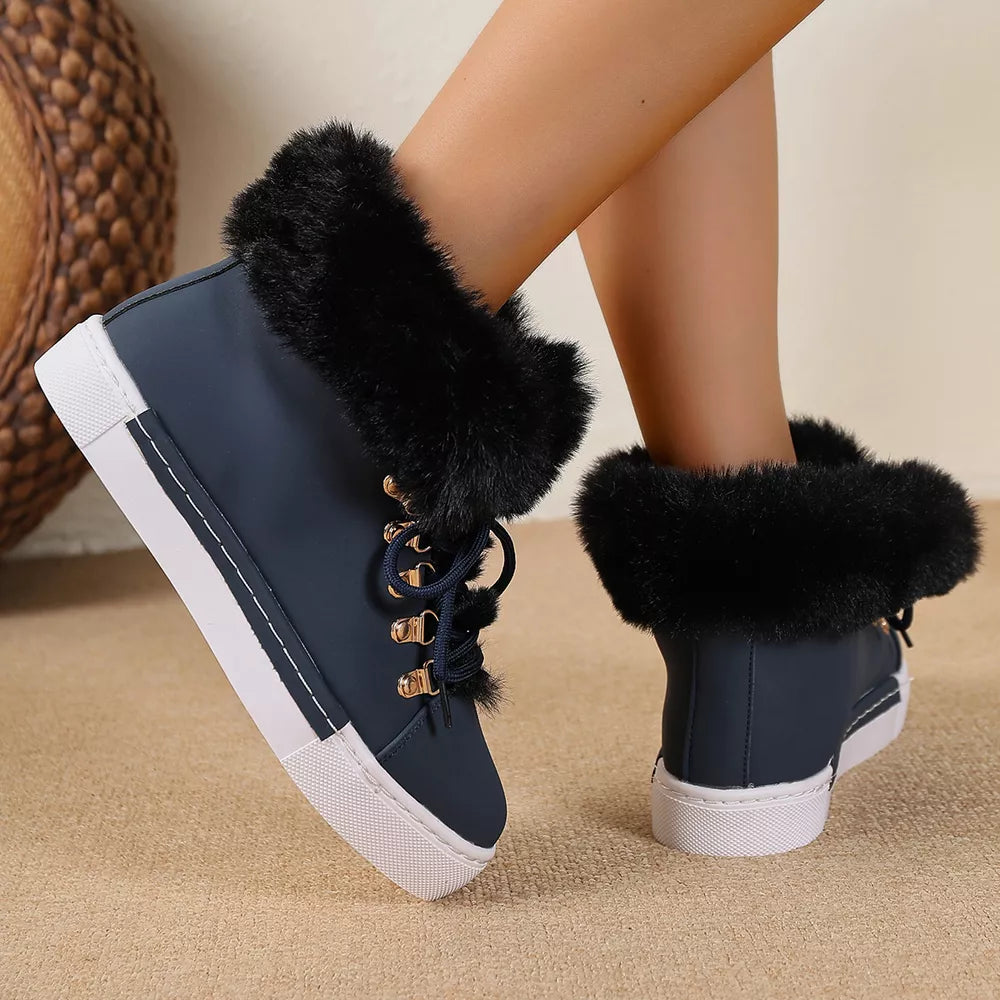 Dark blue round-toe platform boots with fluffy black faux fur cuffs and white soles.