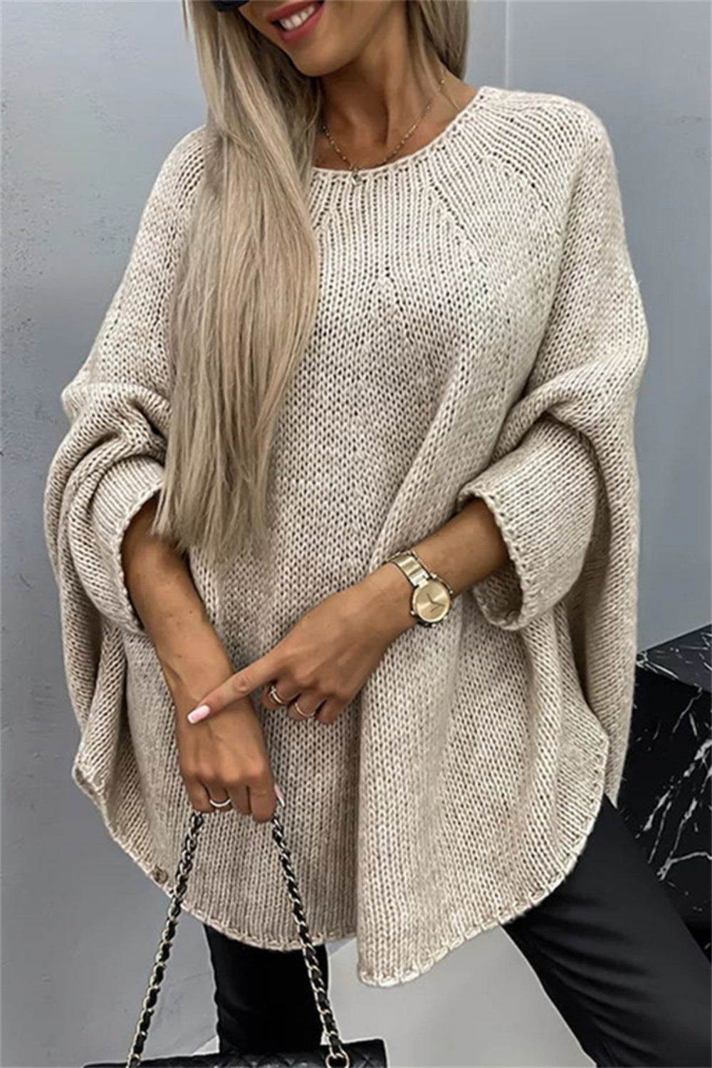 Relaxed knit sweater in Khaki with cape sleeves and a crew neck.