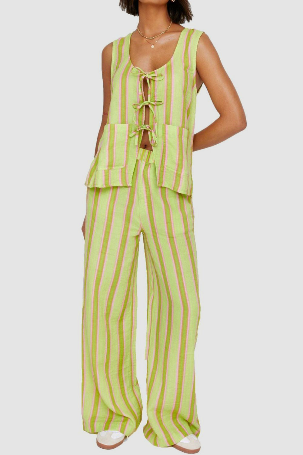 Chartreuse and pink striped linen co-ord set with tie-front top and wide-leg pants.