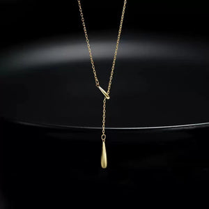 Gold Y-shaped pendant necklace in sterling silver with a delicate teardrop charm.