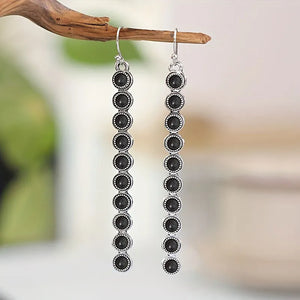 Linear drop earrings with black stones and silver-tone alloy settings