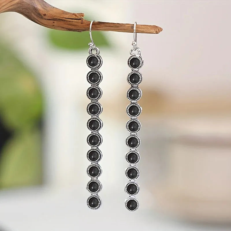 Linear drop earrings with black stones and silver-tone alloy settings
