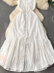 White lace-embroidered cami dress with tiered skirt and button front detail.