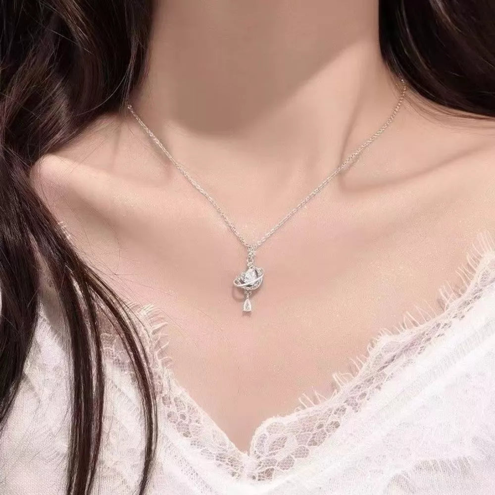Celestial Heart Pendant Necklace with crystal accents on a silver chain.
