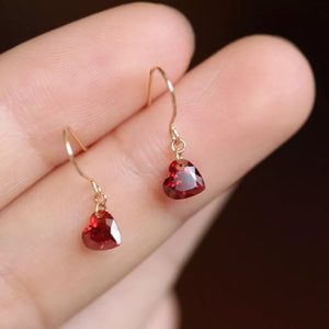 Dainty red heart-shaped zircon drop earrings with gold hooks.