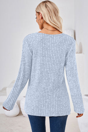 Light Blue ribbed knit sweater with long sleeves and a crew neck.