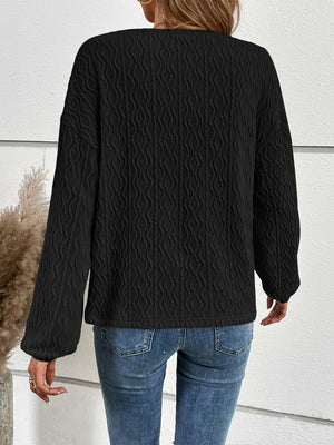 Black textured henley blouson sleeve top with button detail