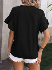 Black textured blouse with flutter sleeves and a casual fit.