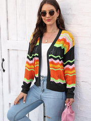 Crochet cardigan with rainbow wave pattern in black, orange, pink, green, and yellow acrylic.