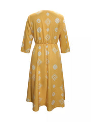 Yellow midi dress with geometric print, 3/4 sleeves, and elastic waist.