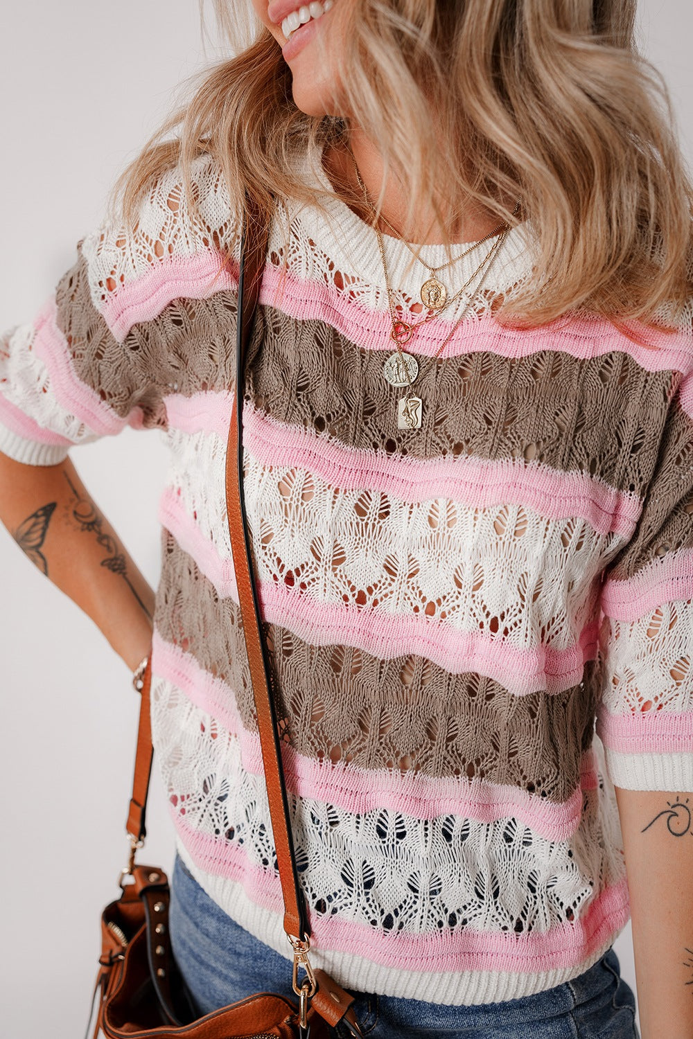 Striped openwork knit top with pink, taupe, and white stripes.