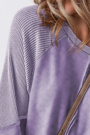 Lavender waffle knit raglan sweatshirt with raw hem detail and contrast fabric.