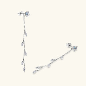 Silver dangling crystal vine earrings with delicate chain and marquise-cut stones.