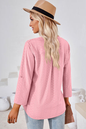 Textured Henley shirt in Blush Pink with roll-tab sleeves and a curved hem.