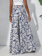 Palazzo trousers in navy with white tropical leaf print, 100% polyester, wide leg.