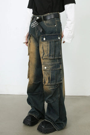 Distressed medium wash denim cargo pants with multiple pockets and a relaxed fit.